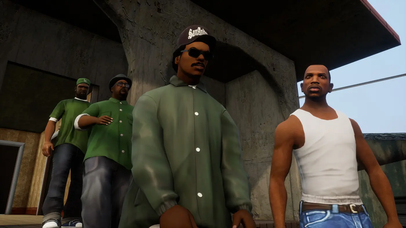 Carl Johnson in a white tank top alongside three Grove Street Families gang members dressed in green, in front of a concrete building, in remastered GTA San Andreas