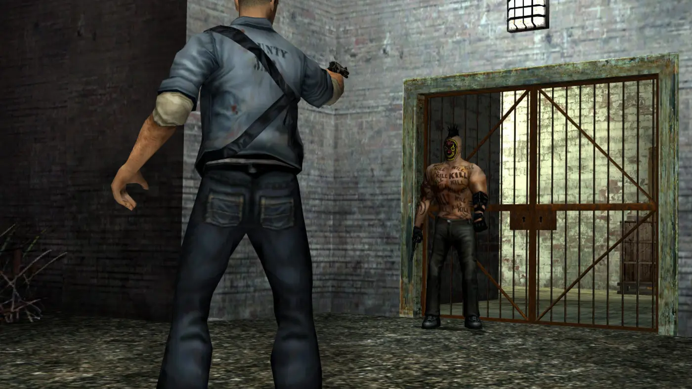 Cash, seen from behind in a prison jumpsuit with a shoulder bag, points a weapon at a bare-chested gang member covered in 'KILL' tattoos and wearing a grimacing mask, in front of a chain-link gate, in Manhunt